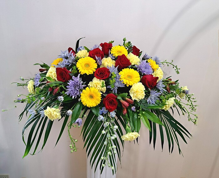 Red, Yellow, and Blue Casket Spray