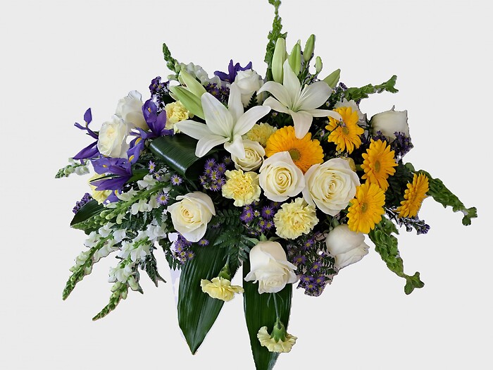 White with Touches of Blue and Yellow Casket Spray